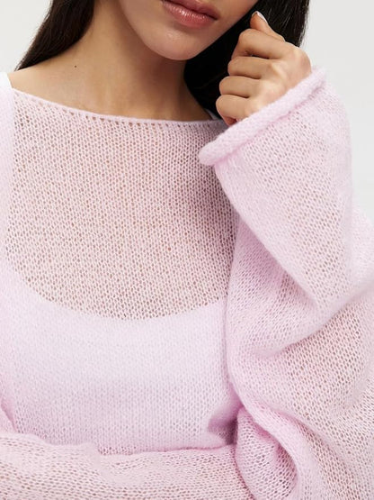 Elayne Knit in Rosa, locker über eine Schulter gezogen
