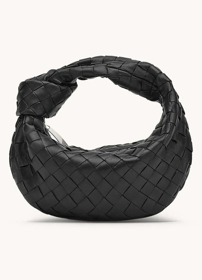zwarte luxe handtas met ronde vorm
