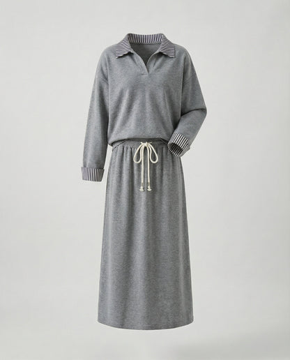 Modisches Frauenensemble mit Oversize Sweatshirt und Midi Rock