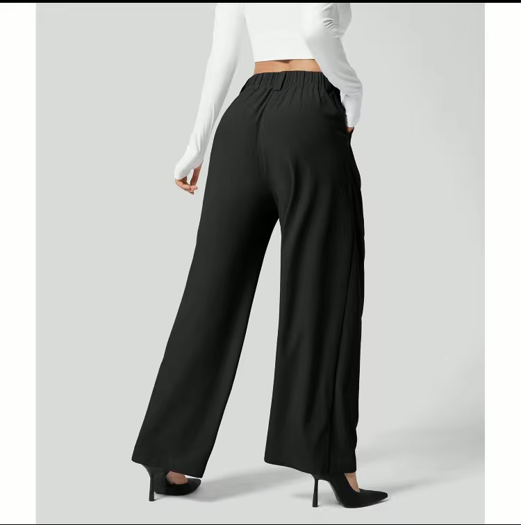 Faye Hose schwarz mit High Waist und weitem Bein
