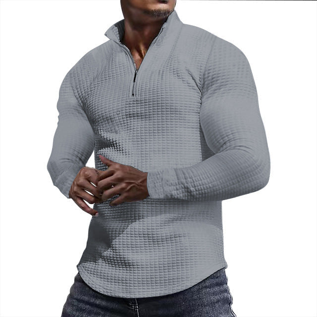 Ein stylisher Langarmshirt mit strukturierter Oberfläche für den modernen Mann. Perfekt für den Alltag, das Fitness-Training oder einfach nur für den Stil. Der Sportliche Langarmshirt ist aus hochwertig