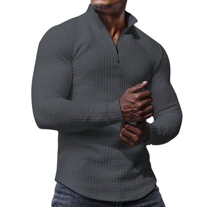 Ein stylisher Langarmshirt mit strukturierter Oberfläche für den modernen Mann. Perfekt für den Alltag, das Fitness-Training oder einfach nur für den Stil. Der Sportliche Langarmshirt ist aus hochwertig
