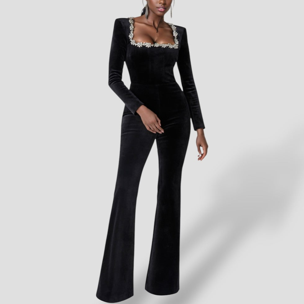 Schwarzer Jumpsuit mit langen Ärmeln und Blumendetail 0