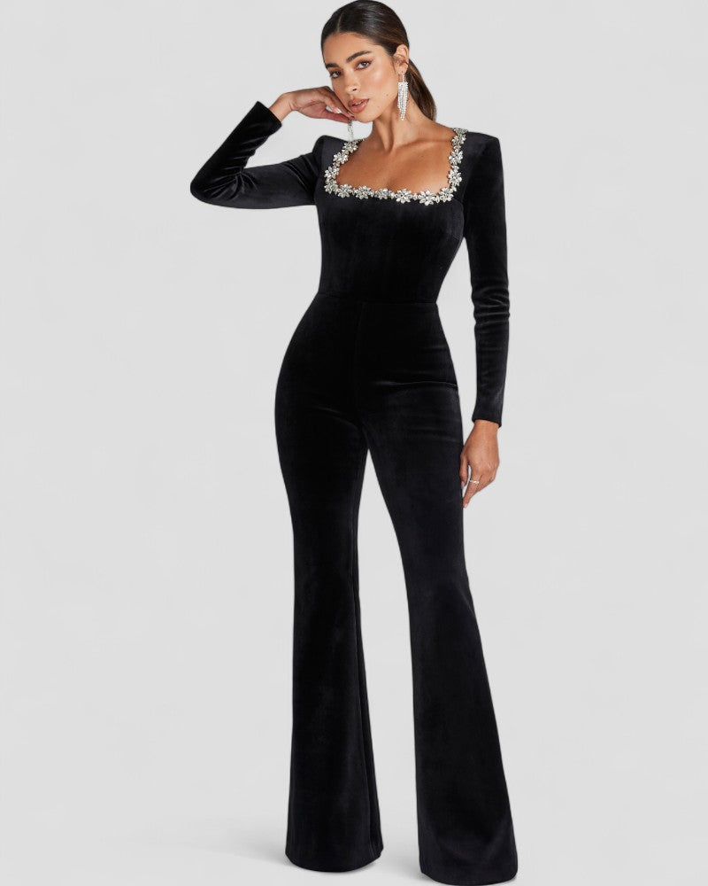 Schwarzer Jumpsuit mit langen Ärmeln und Blumendetail 1