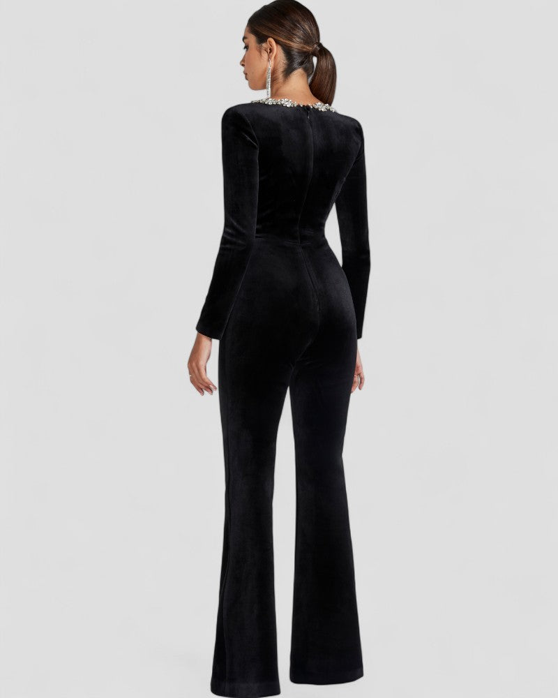 Schwarzer Jumpsuit mit langen Ärmeln und Blumendetail 3