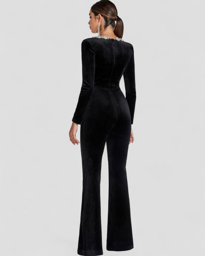 Schwarzer Jumpsuit mit langen Ärmeln und Blumendetail 3
